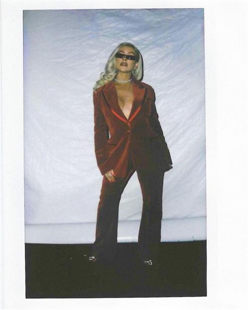 Christina Aguilera Pictures Christina Aguilera braless boobs showing nice cleavage with her big tits in just a low cut jacket.