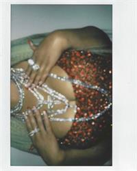 Christina Aguilera braless boobs showing nice cleavage with her big tits in a sexy red dress.