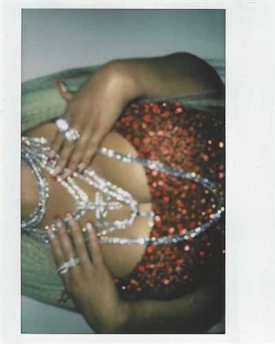 Christina Aguilera braless boobs showing nice cleavage with her big tits in a sexy red dress.