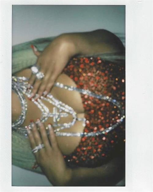 Christina Aguilera Pictures Christina Aguilera braless boobs showing nice cleavage with her big tits in a sexy red dress.