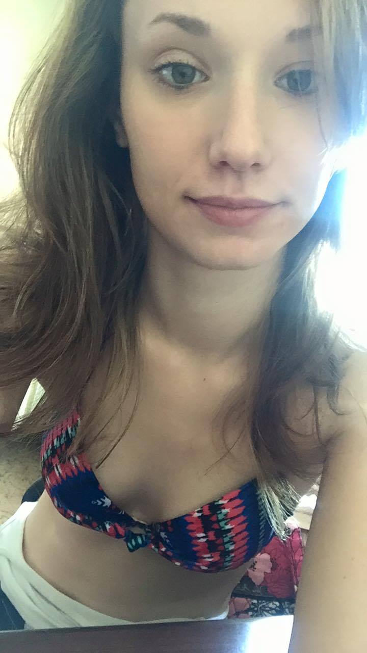 Liv in a bikini taking a selfie