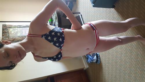 Liv in a bikini taking a selfie