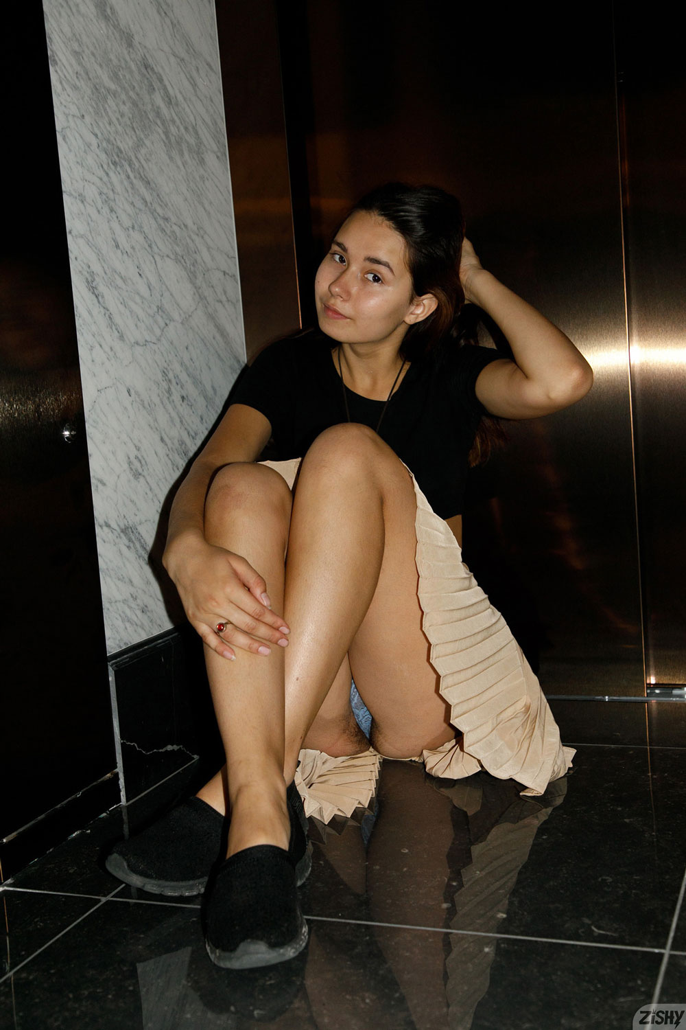 Miki Pedangen in a Blue Bodysuit