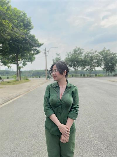 Busty girl in green working suit