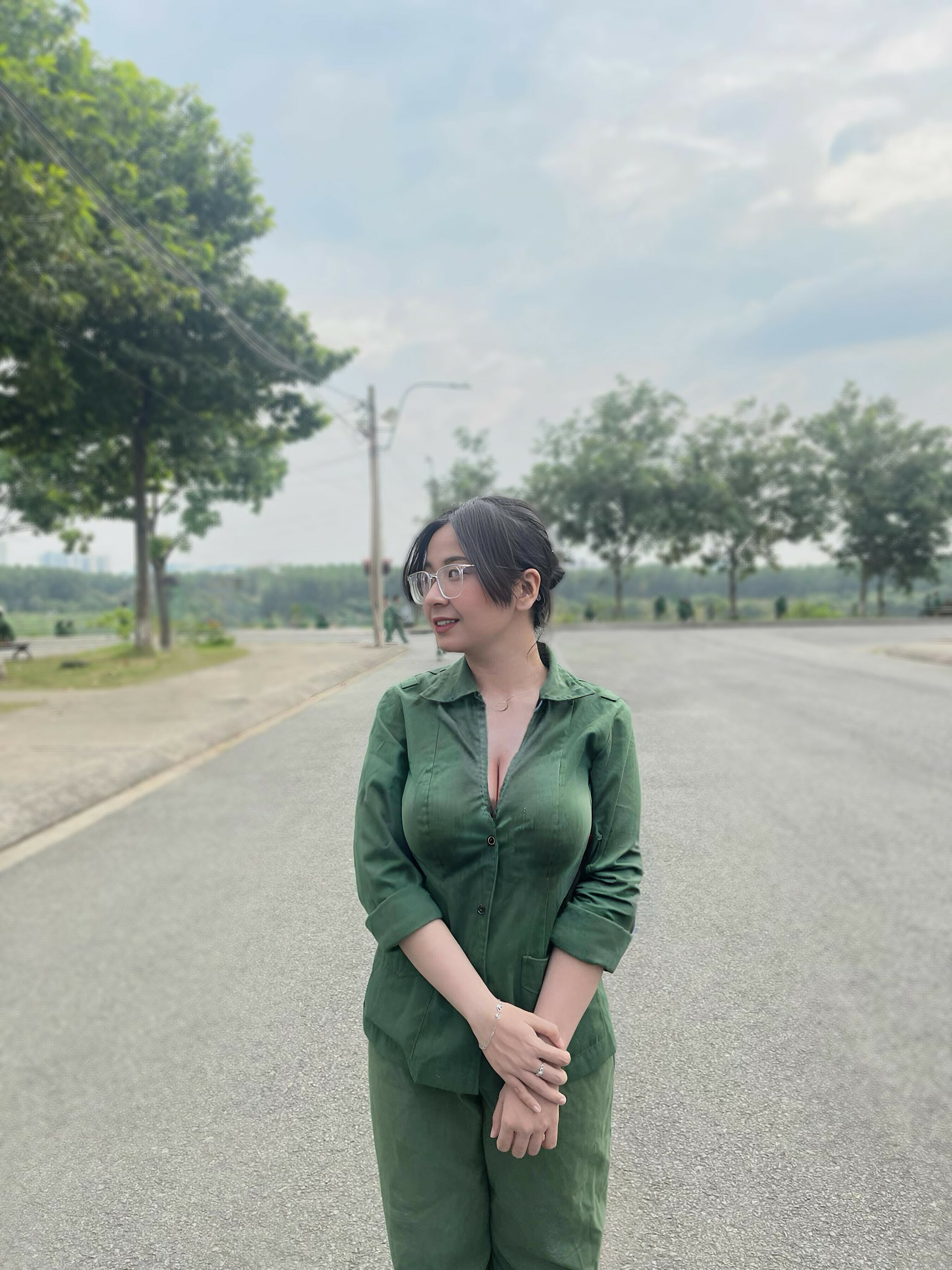 Busty girl in green working suit