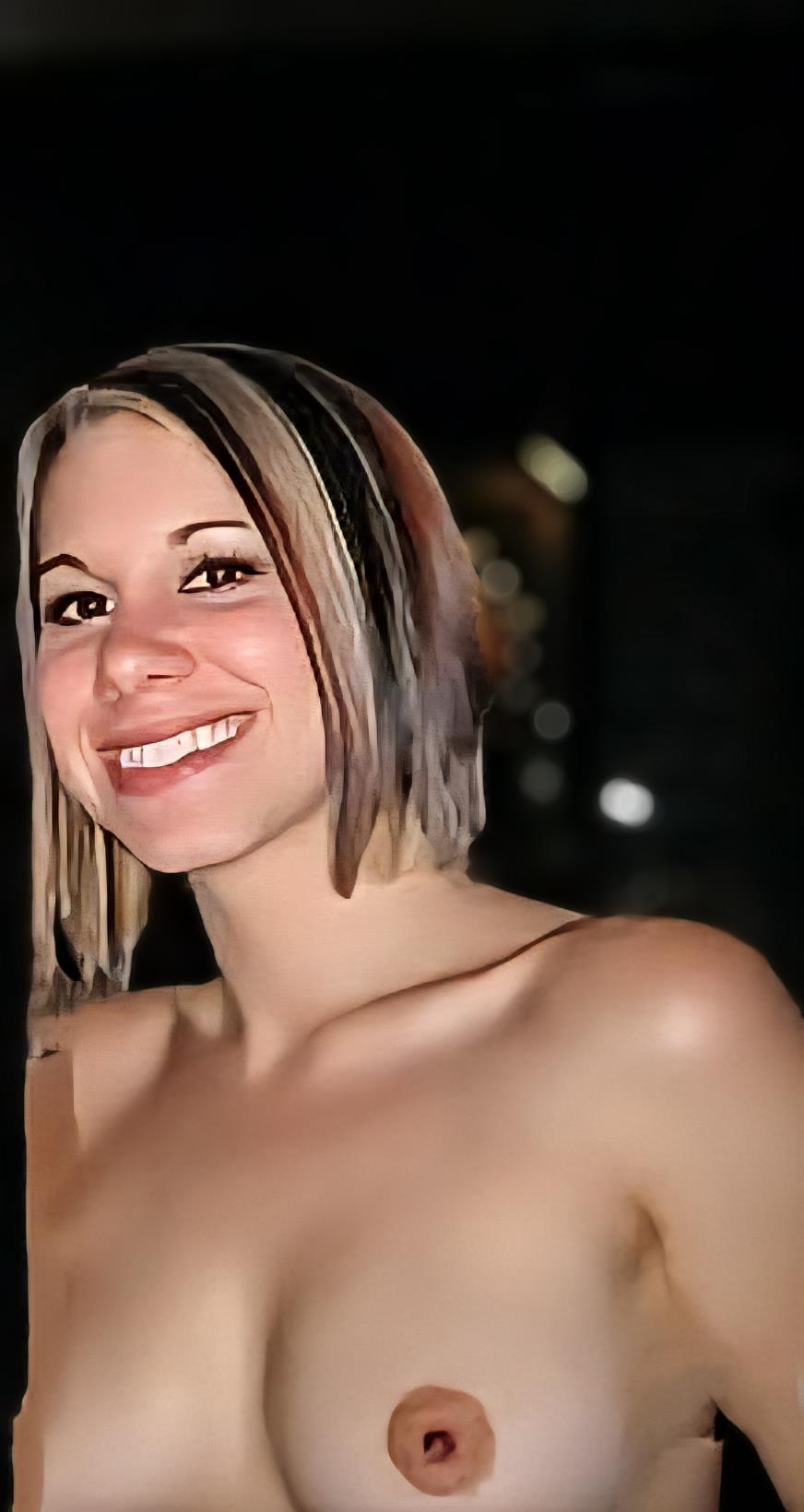 Tanya Lahicke taking a selfie and - breasts