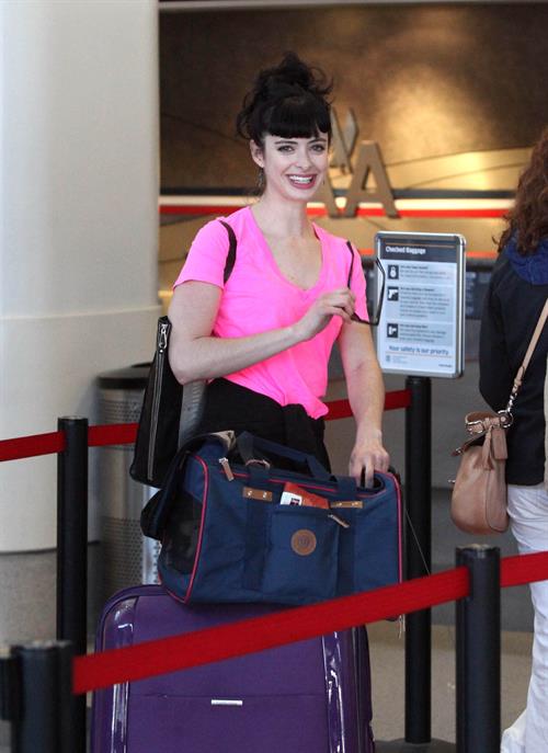 Krysten Ritter - Prepares to leave LAX in Los Angeles, California - June 8, 2012 