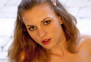 Kasey FTV Nude Pictures Kasey in heels uses a huge dildo on a petite pussy