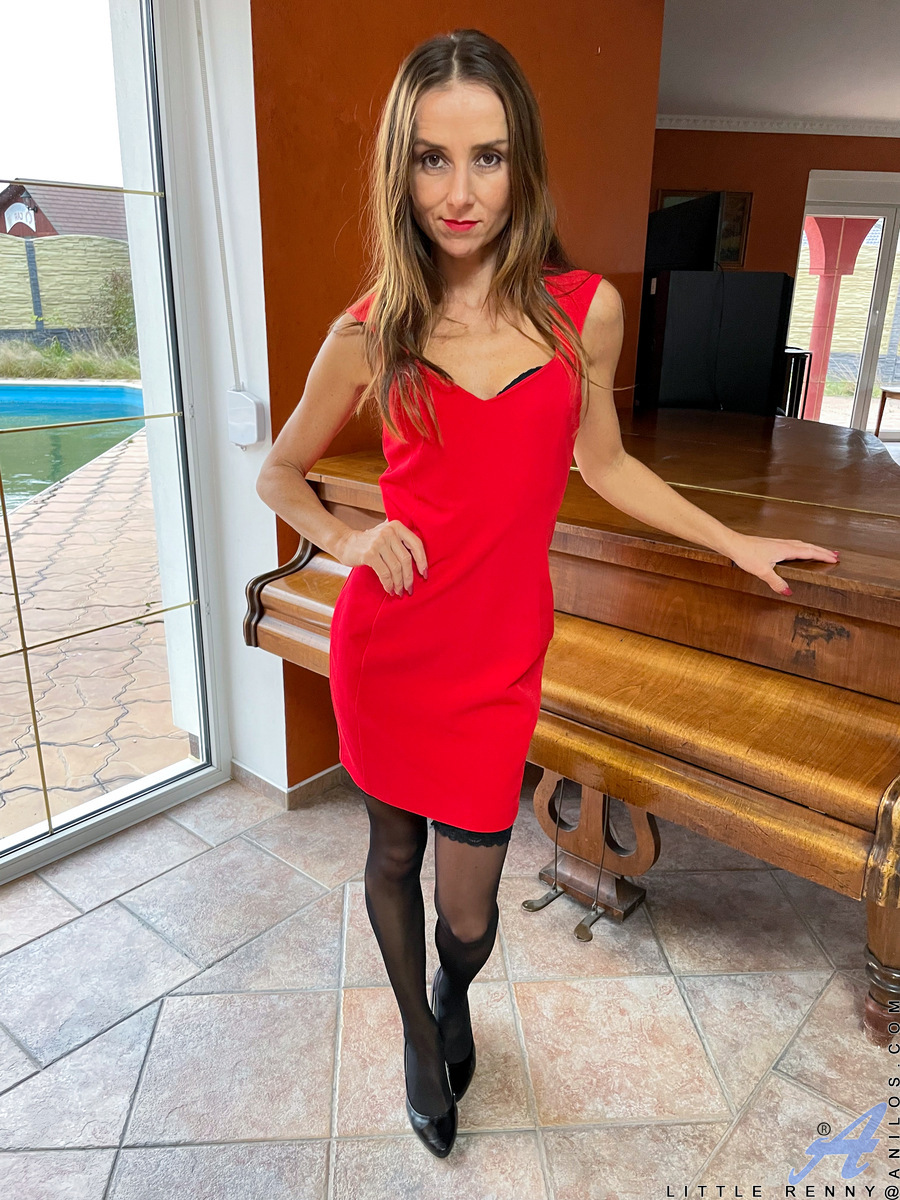 Dressed to impress in her hot red getup that clings to every one of her slim curves Little Renny looks almost good enough to eat. 