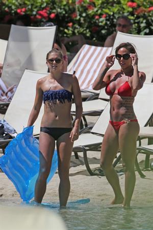 Alex Morgan and Sydney Leroux in bikinis on the beach in Hawaii