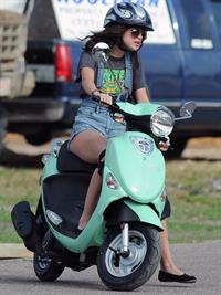 Selena Gomez rides a scooter on set of spring breakers on February 29, 2012 