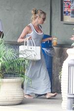 Pamela Anderson leaves barefoot a local Restaurant with a friend in Malibu July 6, 2013 