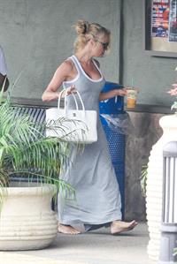 Pamela Anderson leaves barefoot a local Restaurant with a friend in Malibu July 6, 2013 
